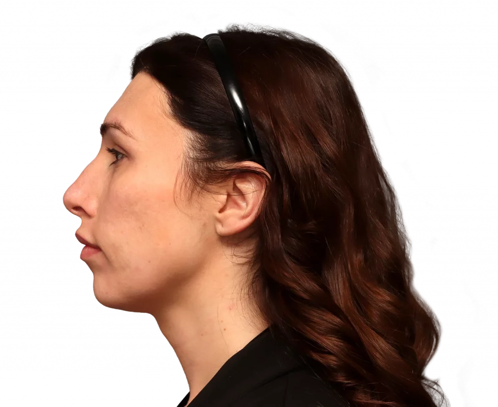 Side profile of a woman with dark brown hair wearing a black headband, facing left.