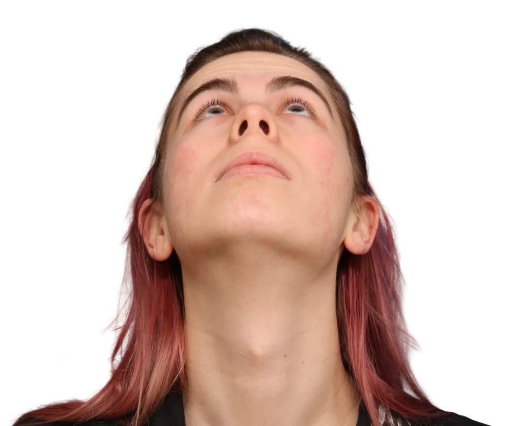 Close-up of a person tilting their head back and looking upward, showing the jawline and neck.